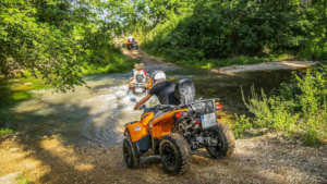 The quad tour crosses the river