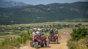 Quad tour with a hamlet in the background